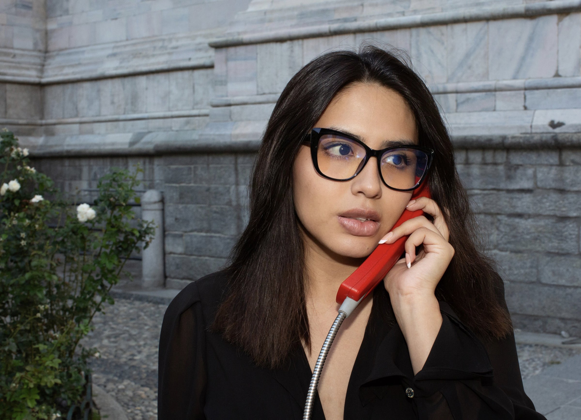 Woman outdoors wearing black LadyBoss glasses