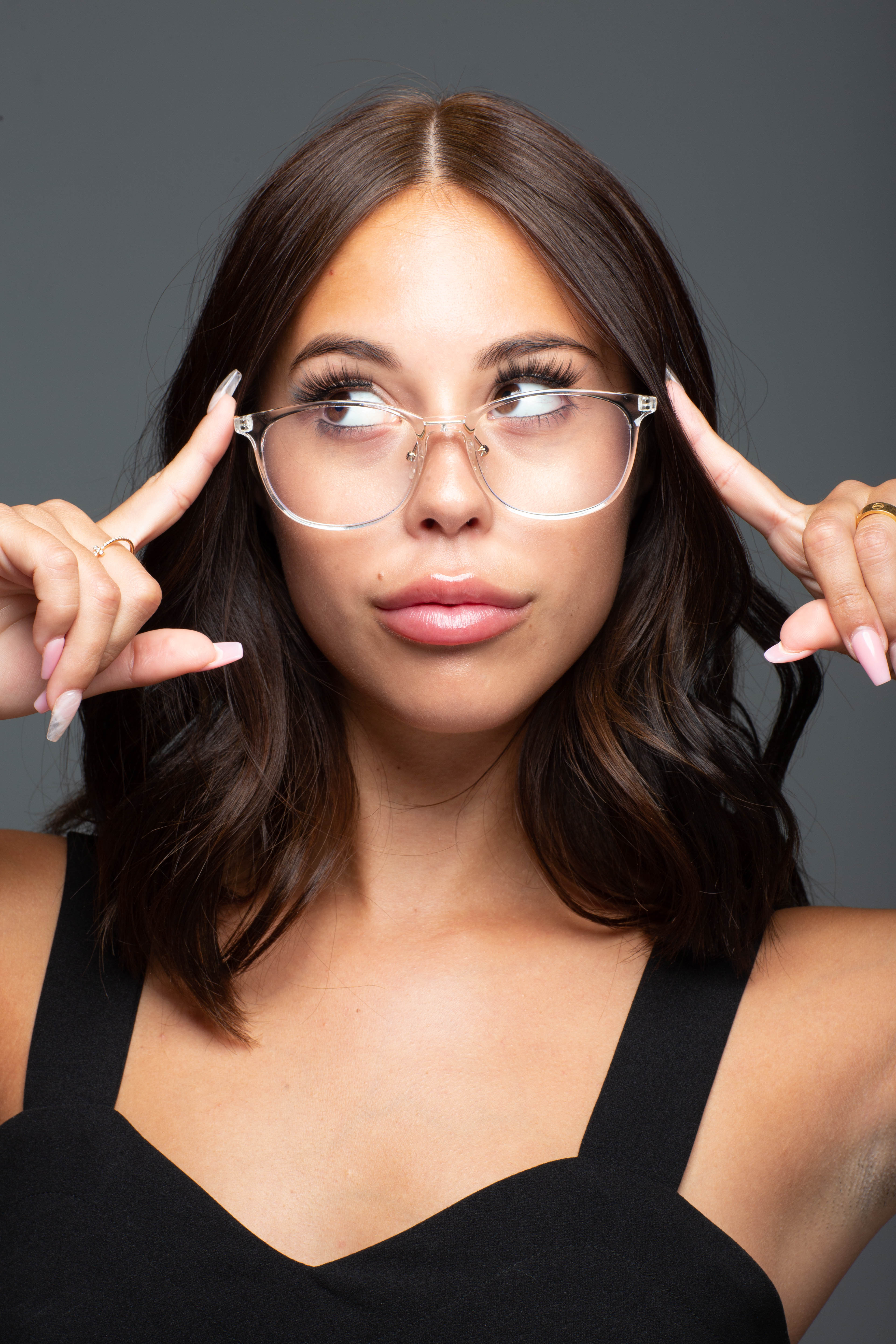 Model wearing LadyBoss Minimals eyeglasses in Crystal Clear #frame color_crystal clear