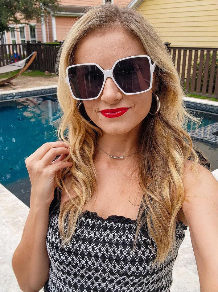 Model wearing LadyBoss Glamours sunglasses in White #frame color_white