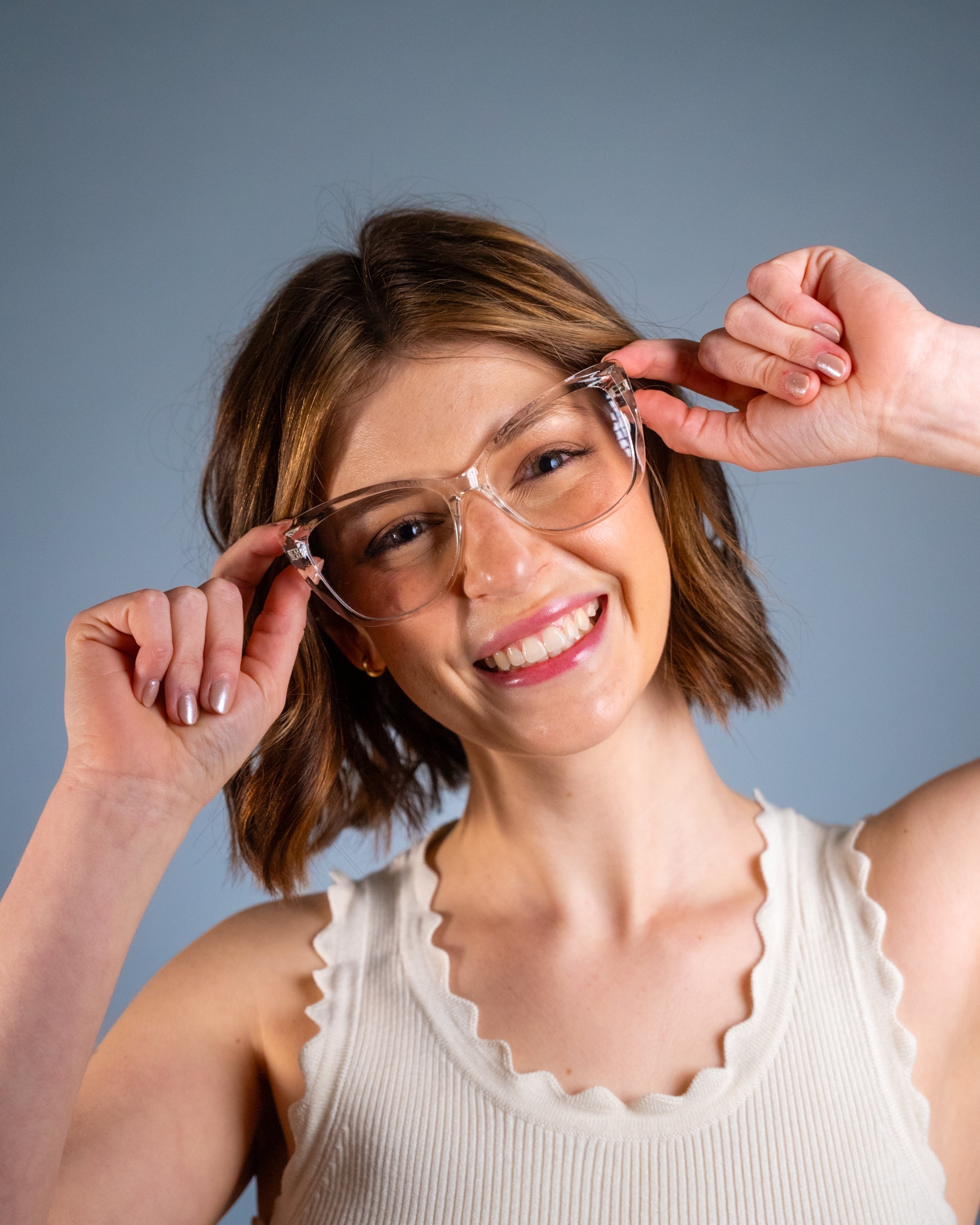 Model wearing LadyBoss Alloras eyeglasses in Crystal Clear #frame color_crystal clear