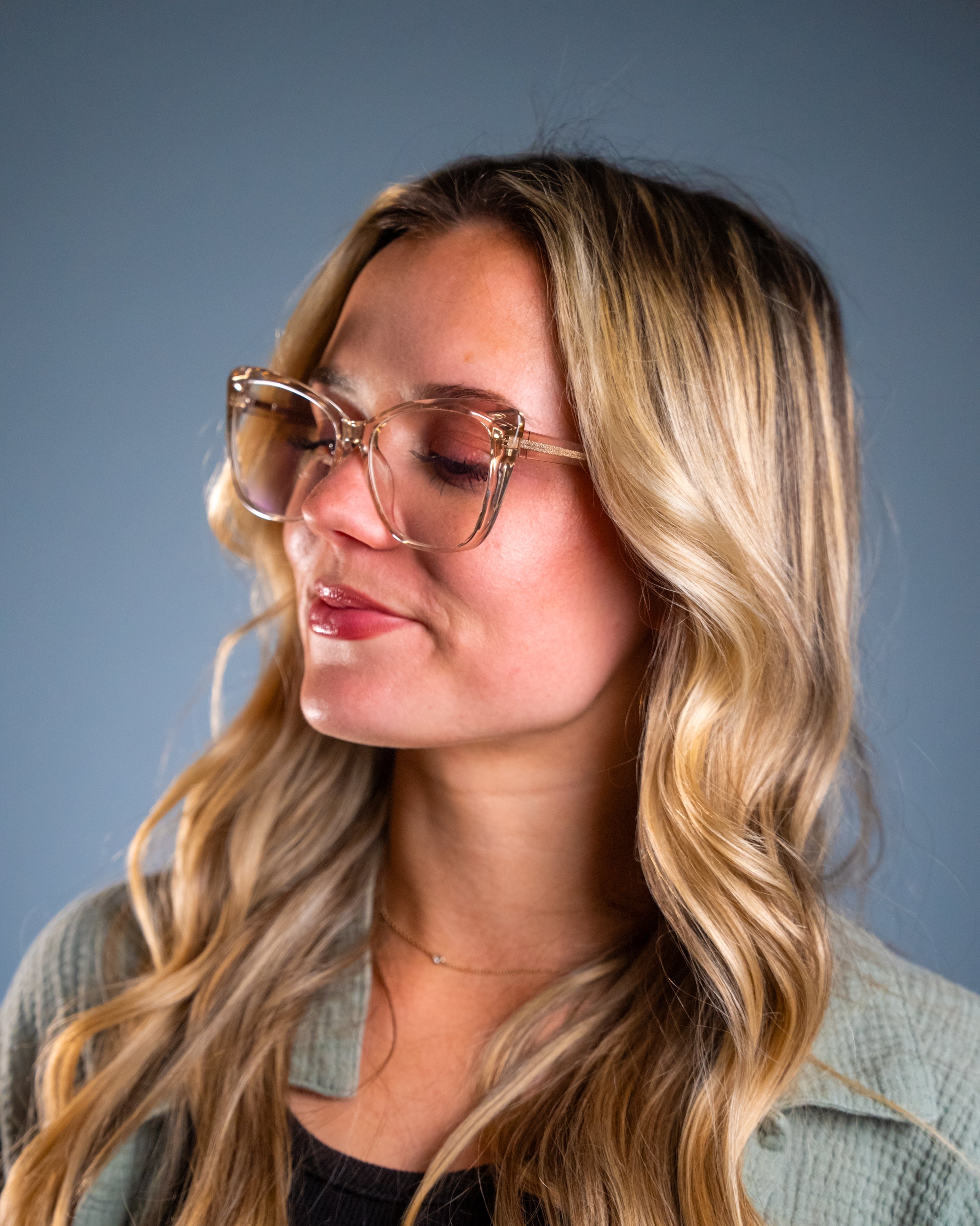 Model wearing LadyBoss Alloras eyeglasses in Light Pink #frame color_light pink