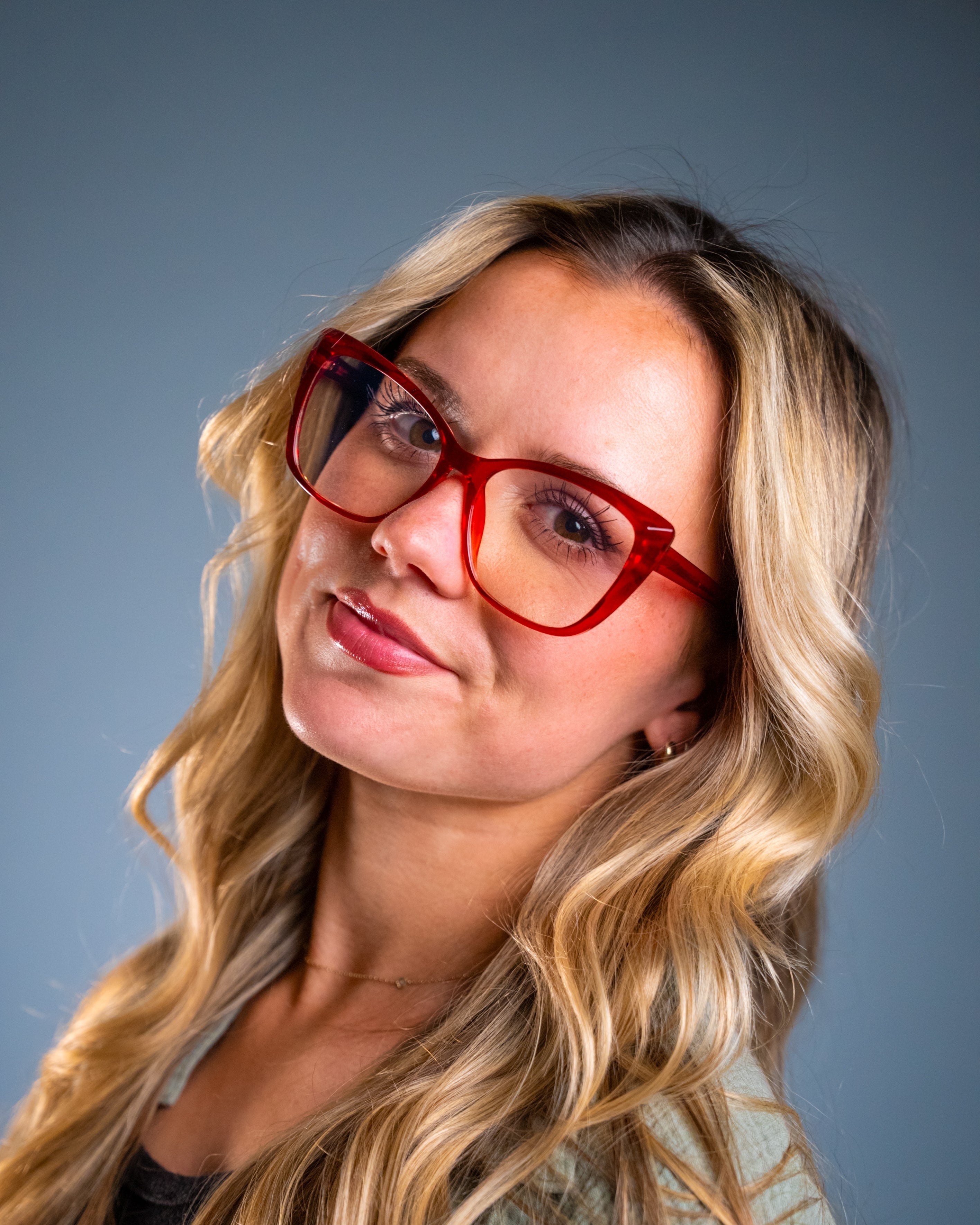 Model wearing LadyBoss Alloras eyeglasses in Cardinal Crystal #frame color_cardinal crystal