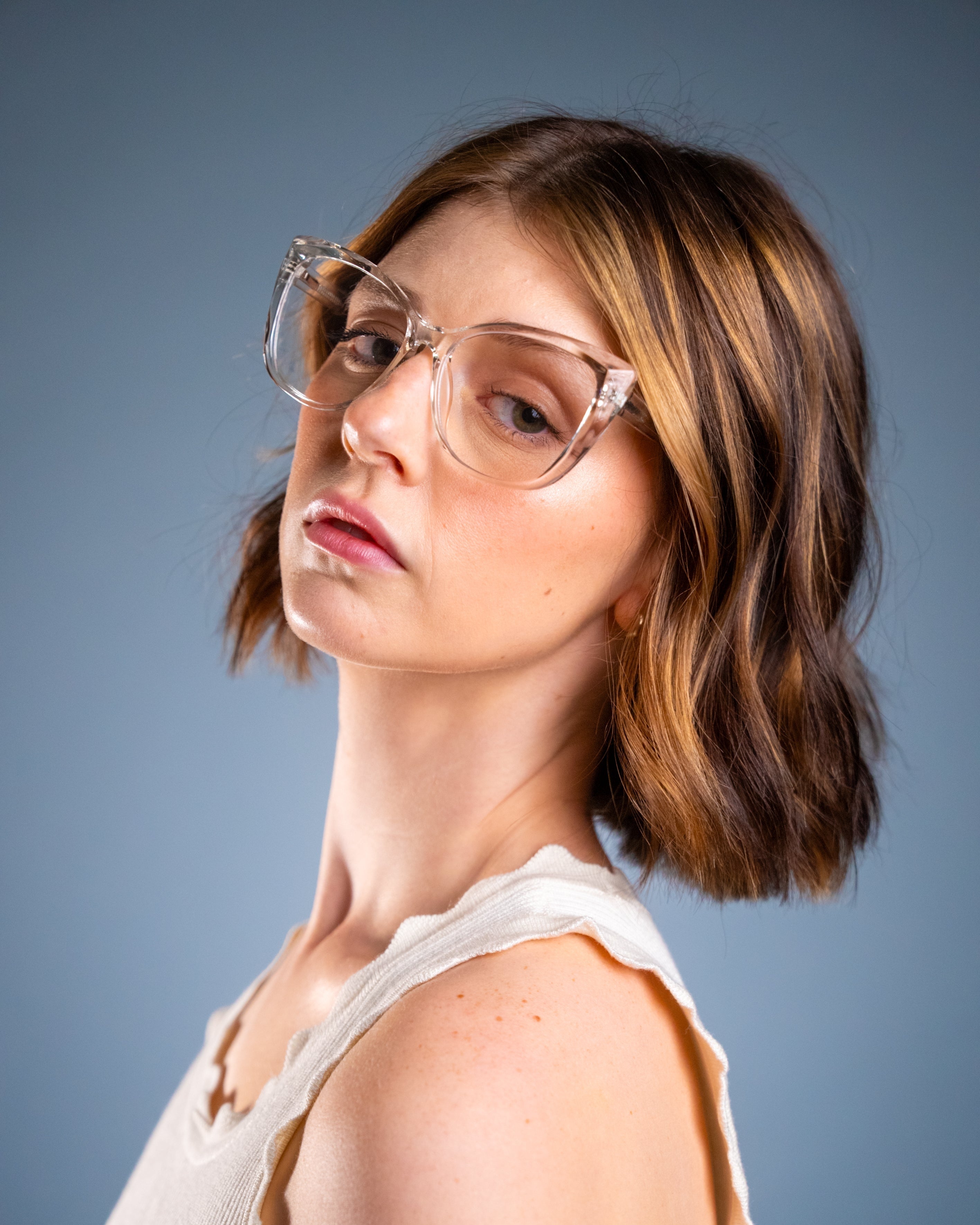 Model wearing LadyBoss Alloras eyeglasses in Crystal Clear #frame color_crystal clear