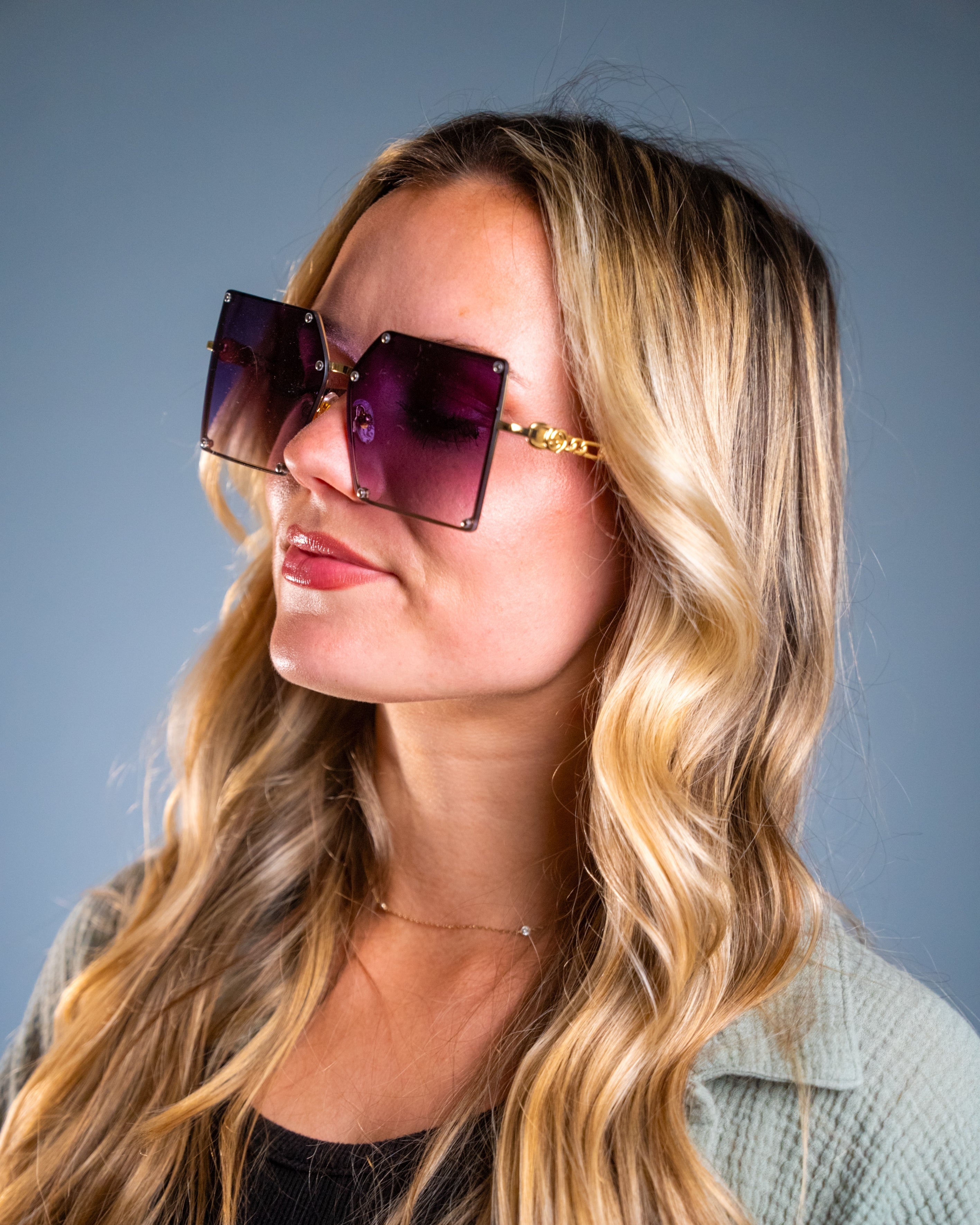 Model wearing LadyBoss Elevations sunglasses in Violet #frame color_violet