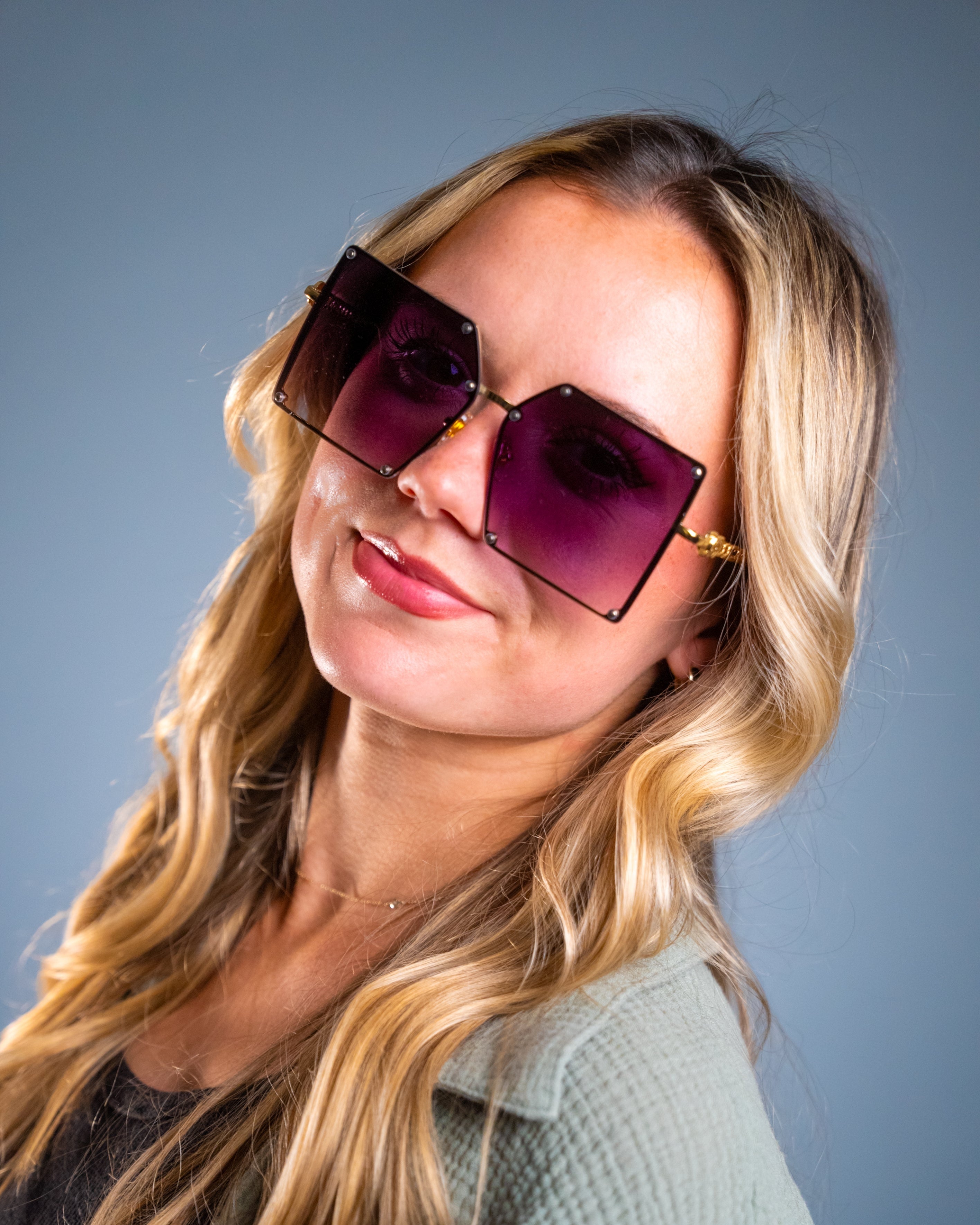 Model wearing LadyBoss Elevations sunglasses in Violet #frame color_violet