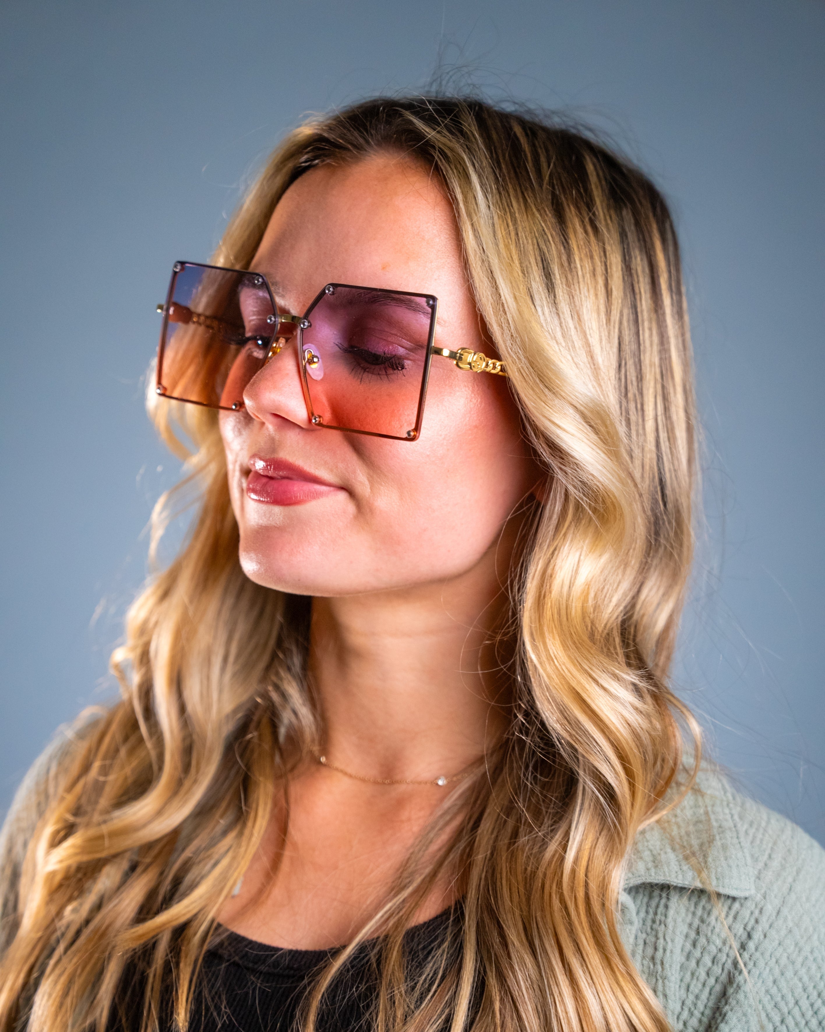 Model wearing LadyBoss Elevations sunglasses in Powder Blue #frame color_powder blue