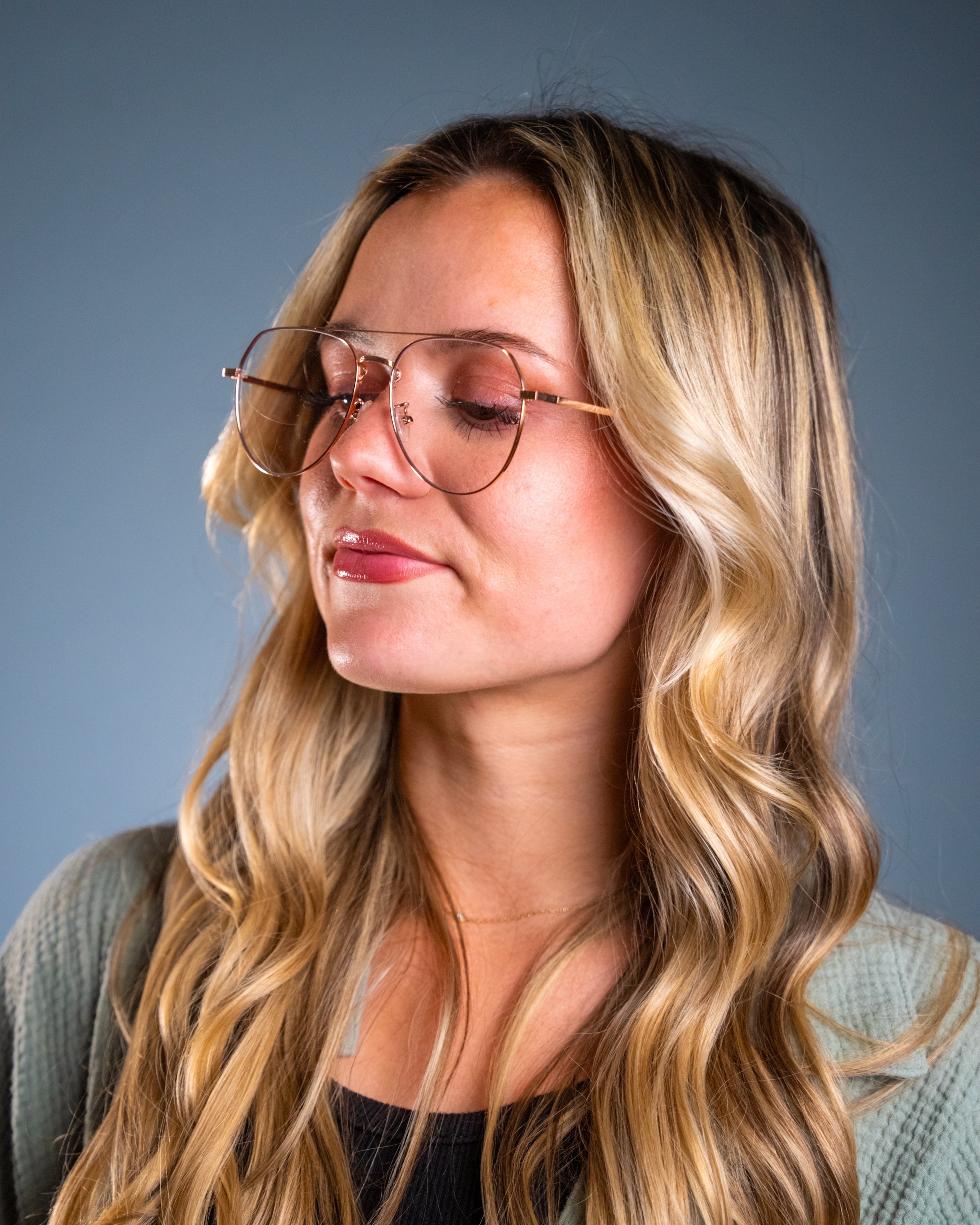 Model wearing LadyBoss Evocatives eyeglasses in Gold #frame color_gold