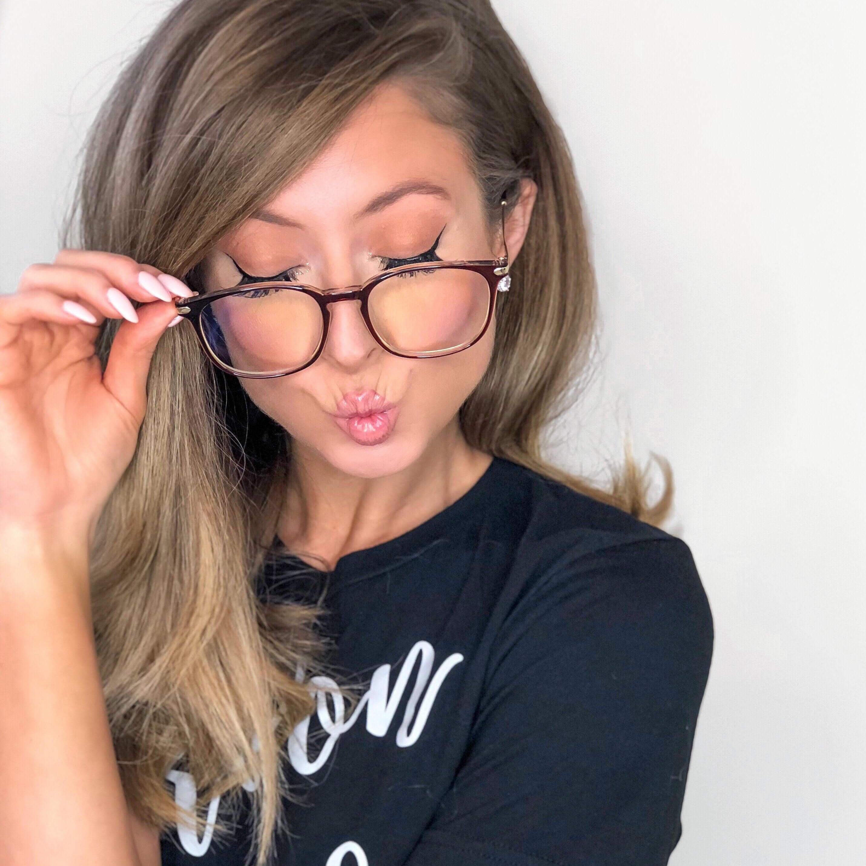 Woman wearing stylish prescription glasses from LadyBoss Glasses