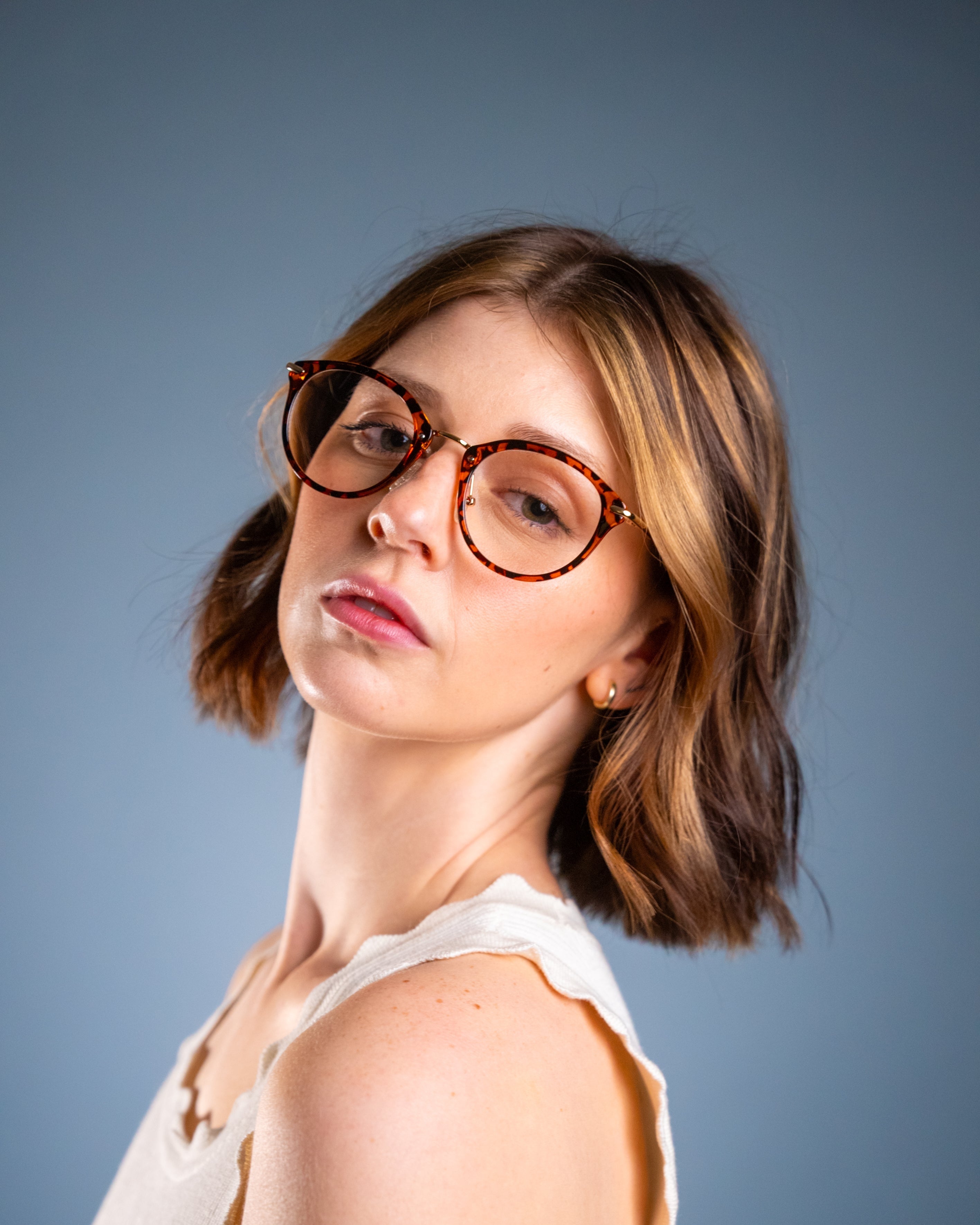 Model wearing LadyBoss Visionaries eyeglasses in Leopard #frame color_leopard