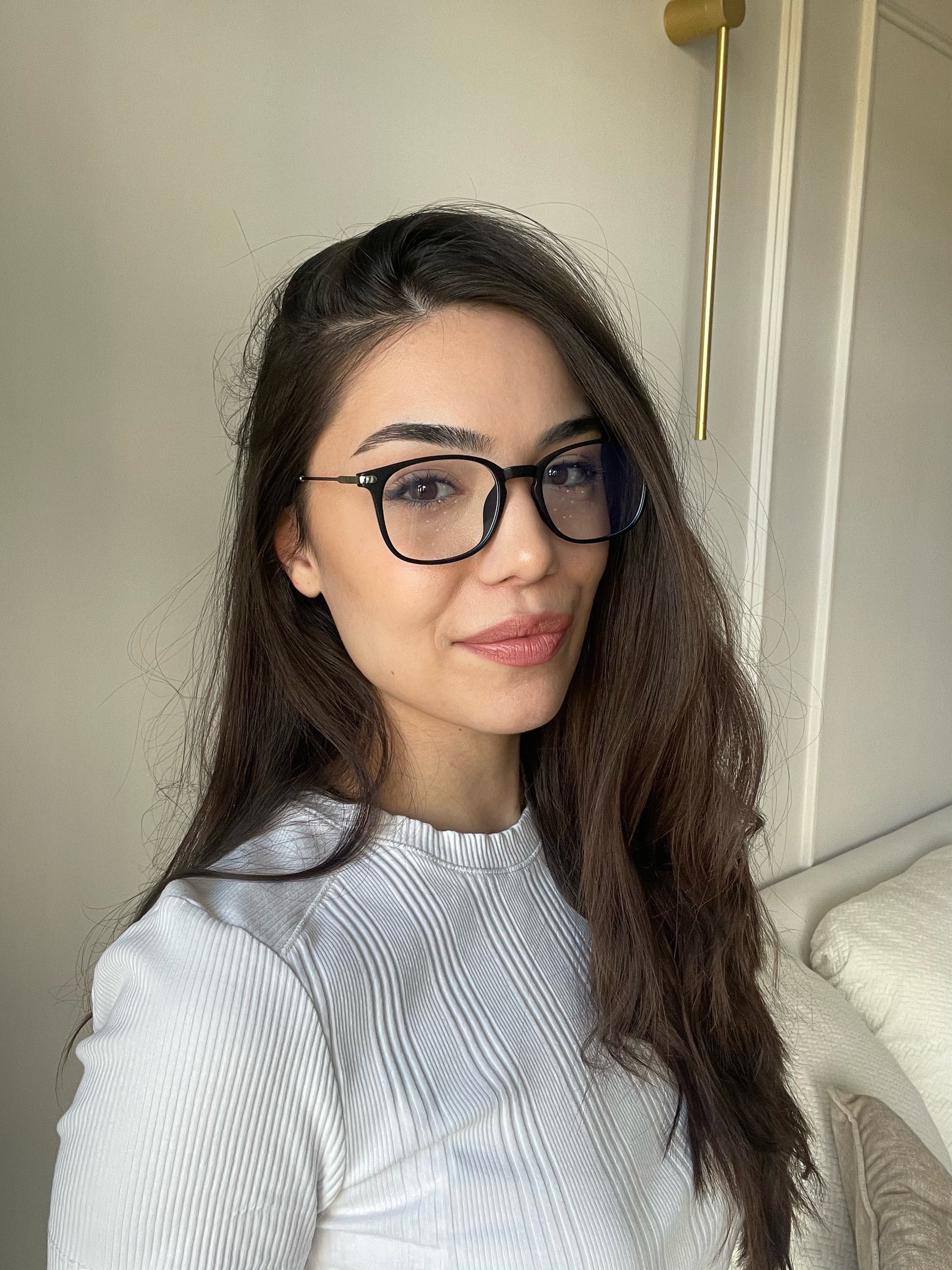 Woman at home wearing black LadyBoss glasses