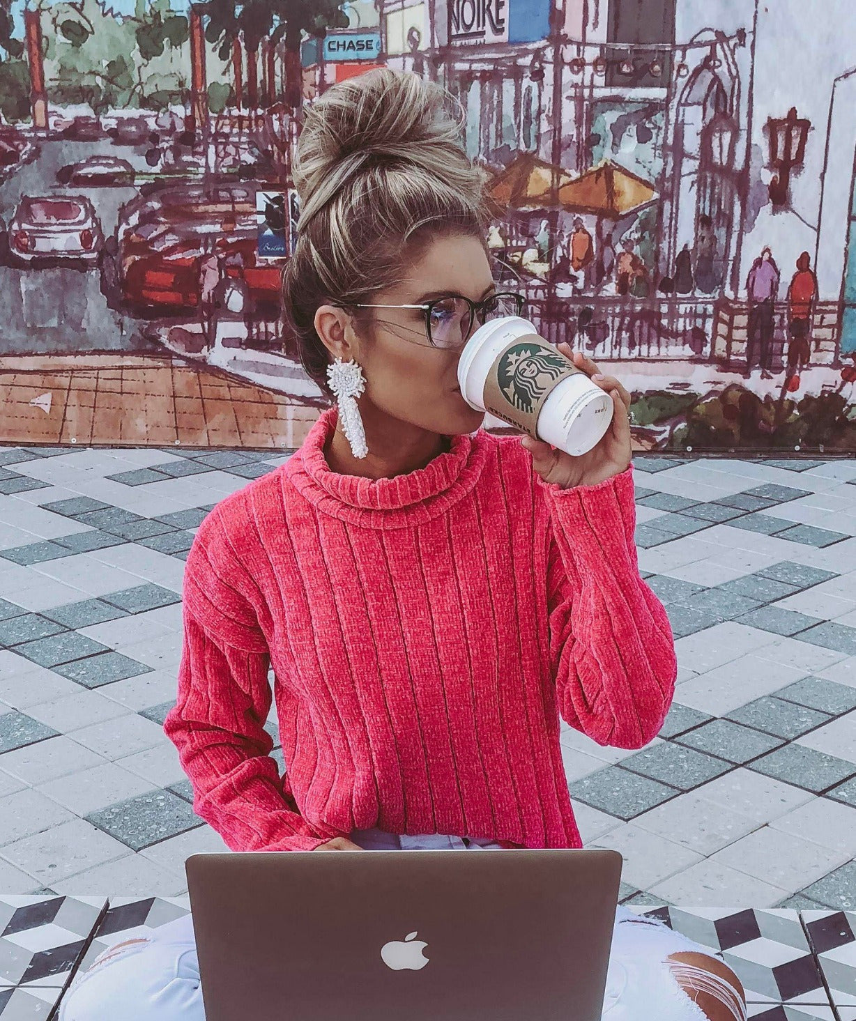 Woman at a laptop wearing gradient LadyBoss glasses