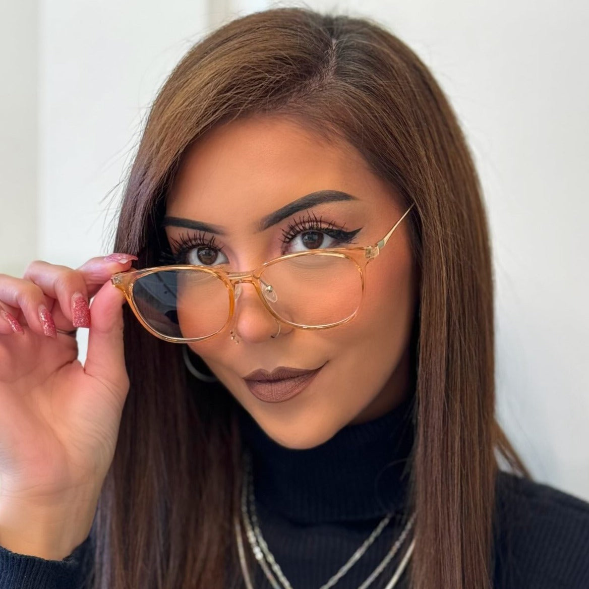 Model wearing LadyBoss Minimals eyeglasses in Coffee