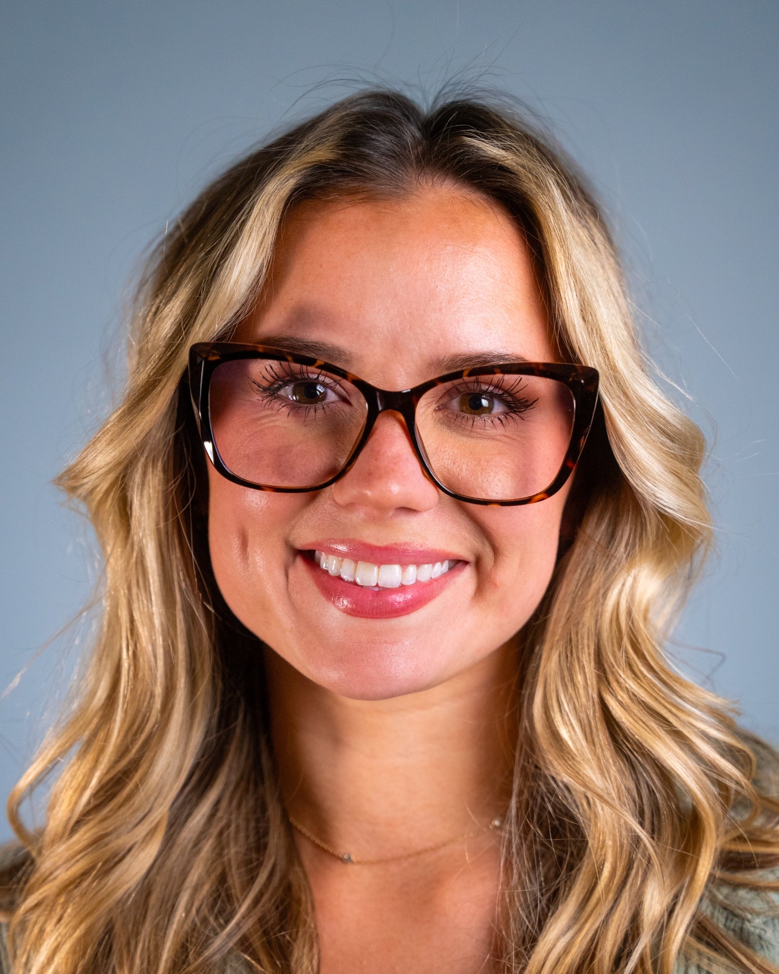 Model wearing LadyBoss Alloras eyeglasses in Tortoise