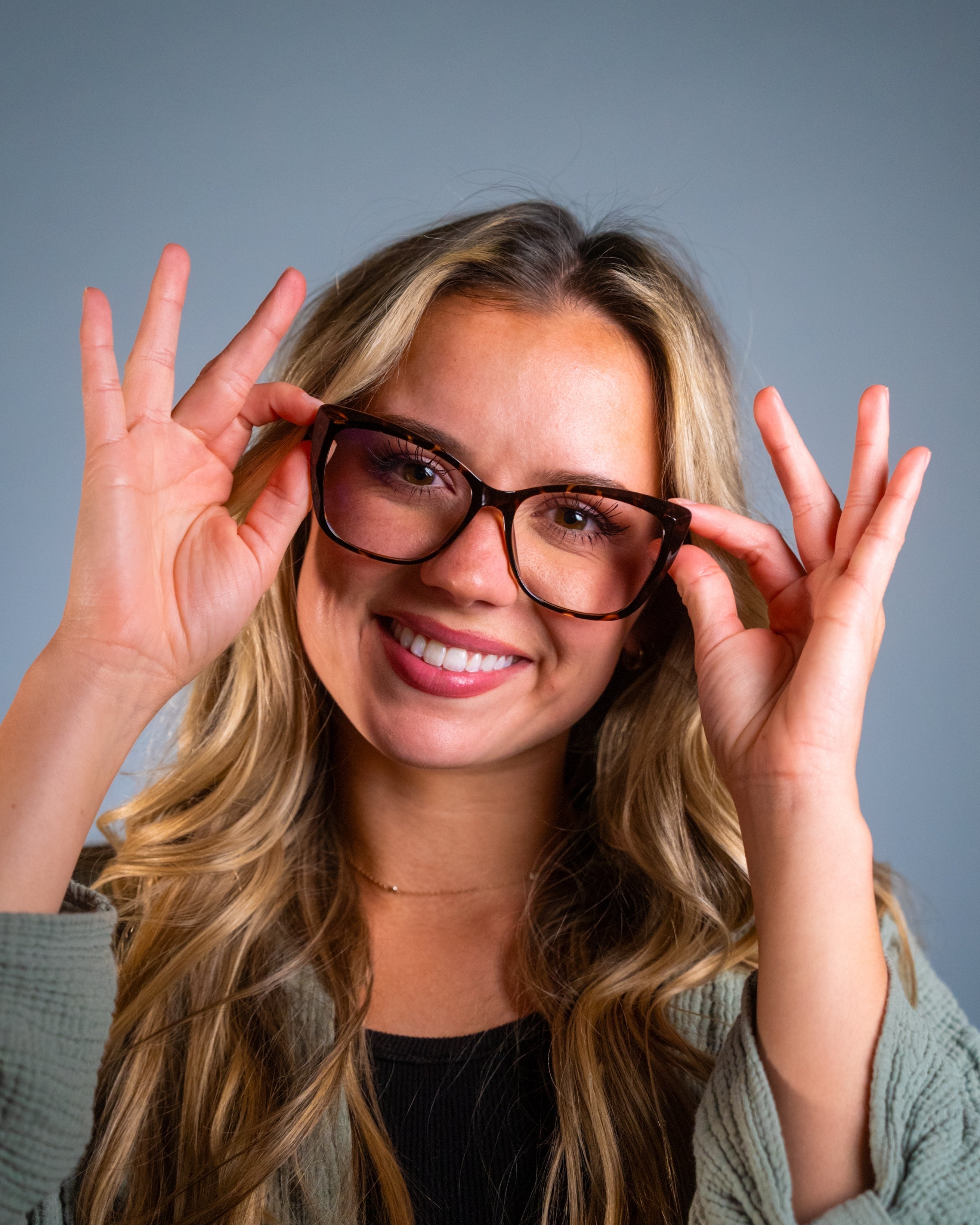 Model wearing LadyBoss Alloras eyeglasses in Tortoise #frame color_tortoise