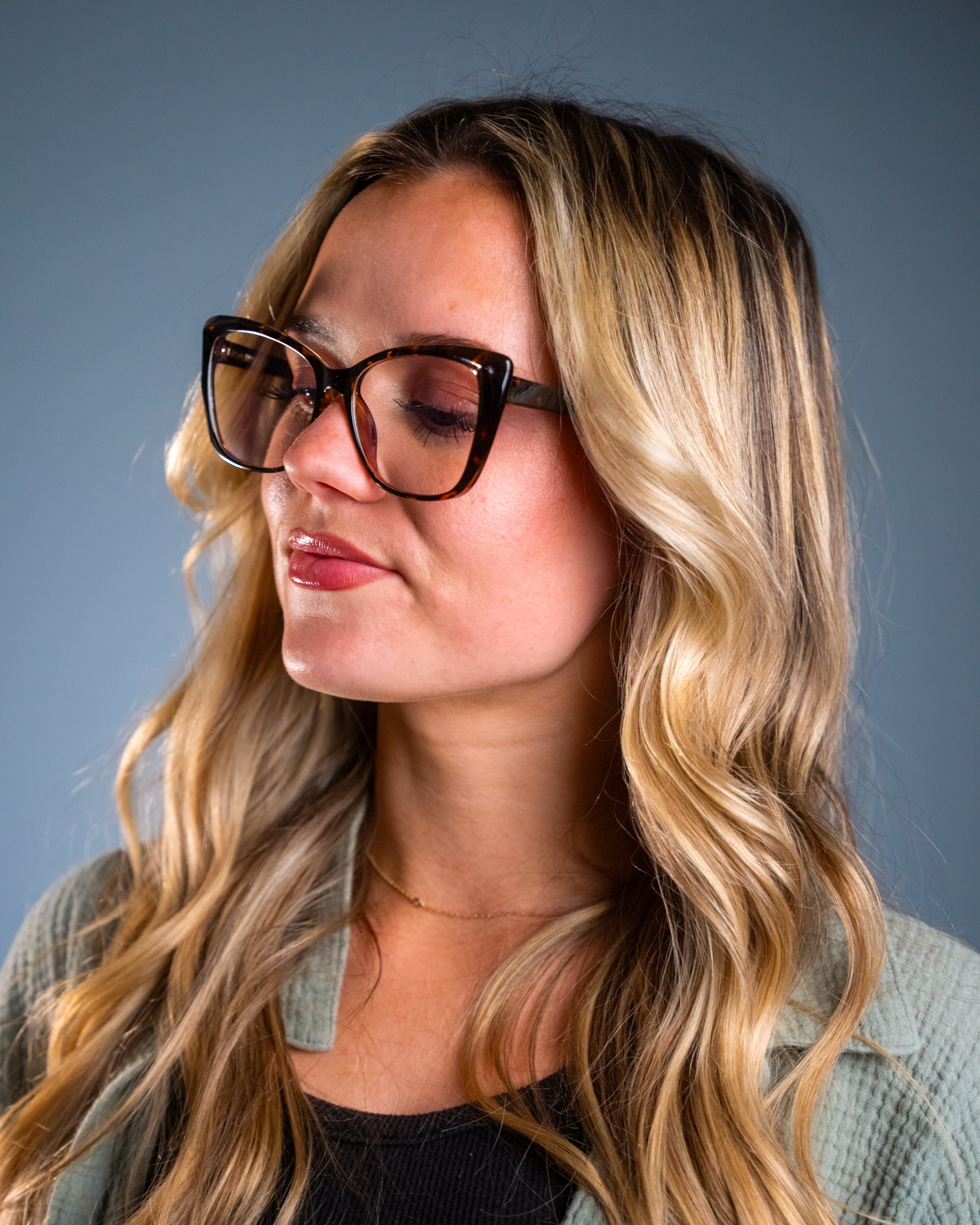 Model wearing LadyBoss Alloras eyeglasses in Tortoise #frame color_tortoise