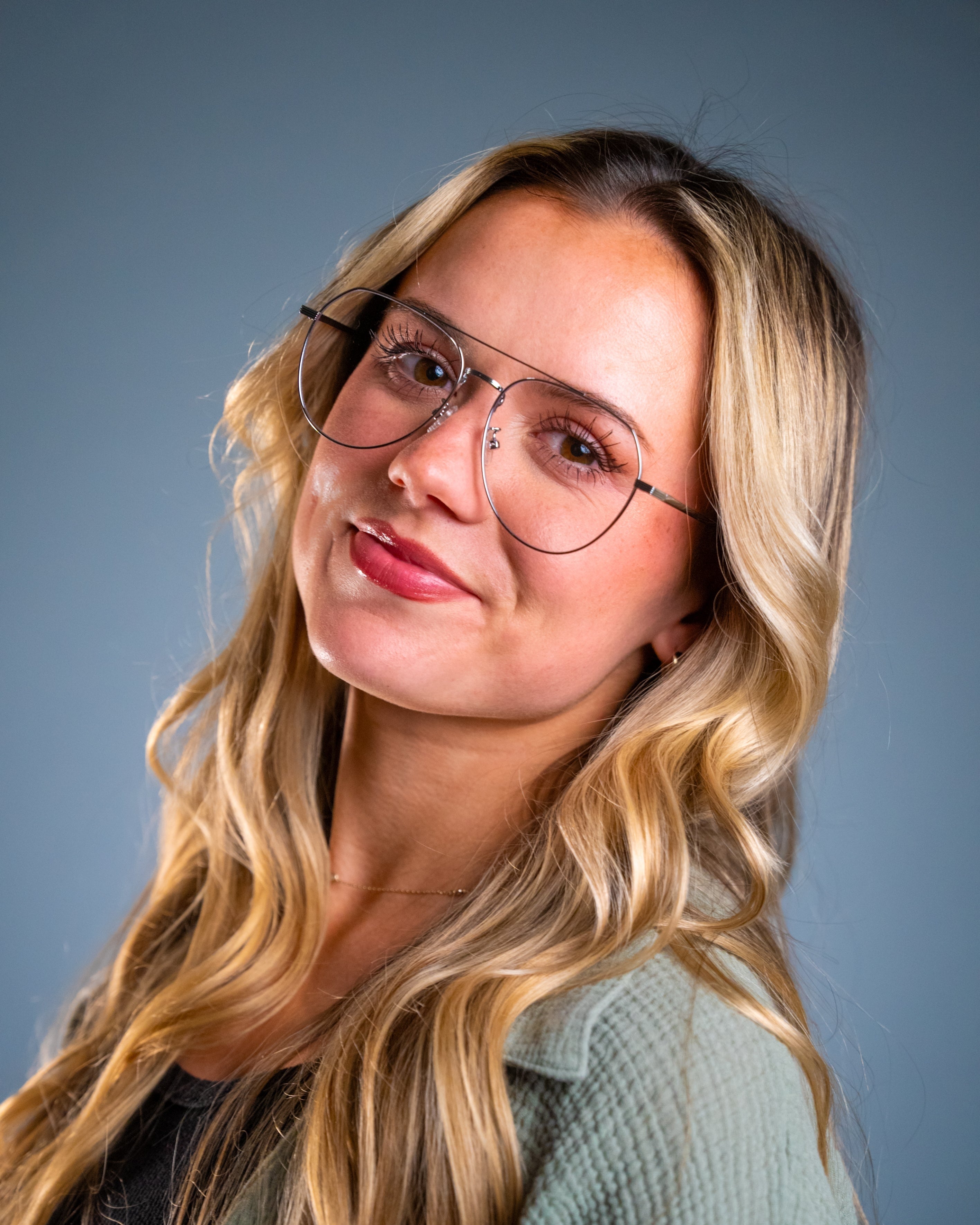 Model wearing LadyBoss Evocatives eyeglasses in Silver #frame color_silver