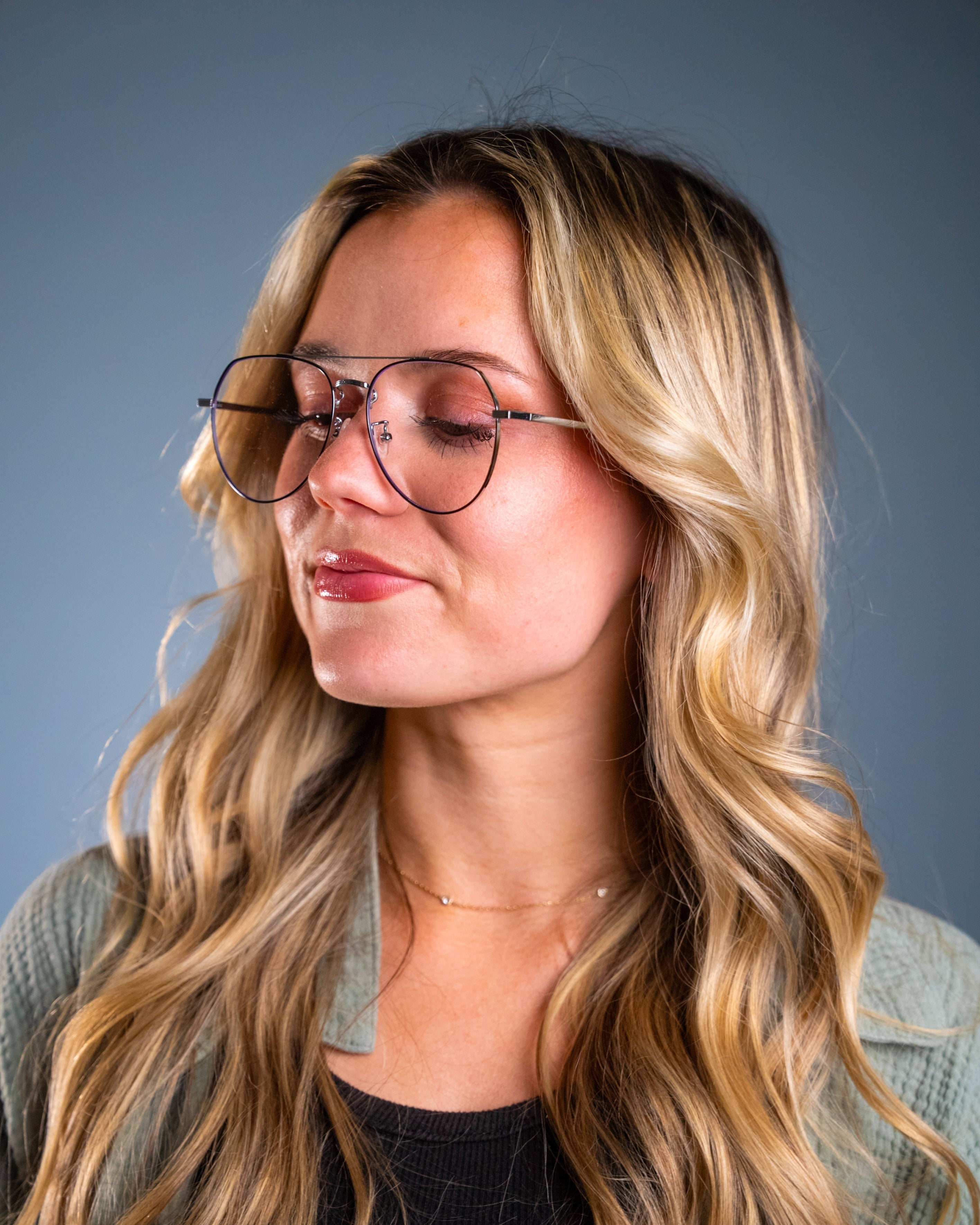 Model wearing LadyBoss Evocatives eyeglasses in Black & Silver #frame color_black & silver