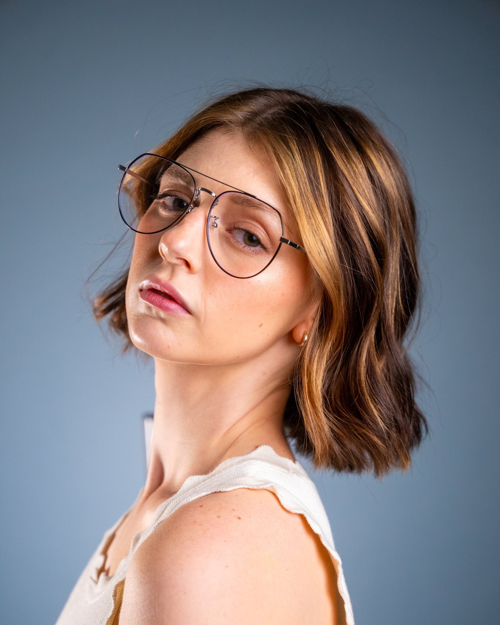 Model wearing LadyBoss Evocatives eyeglasses in Black & Silver