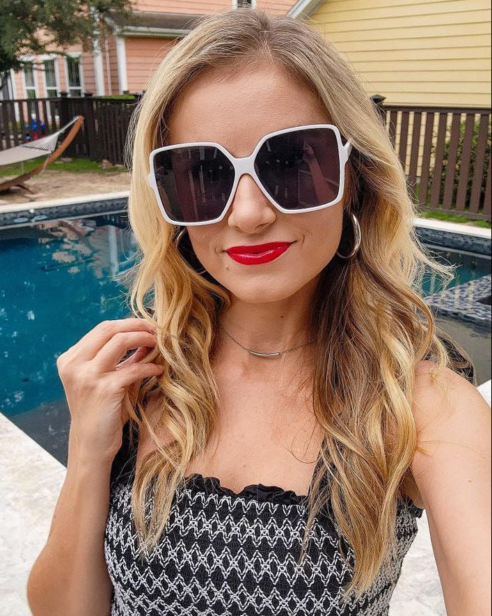 Model wearing LadyBoss Glamours sunglasses in White