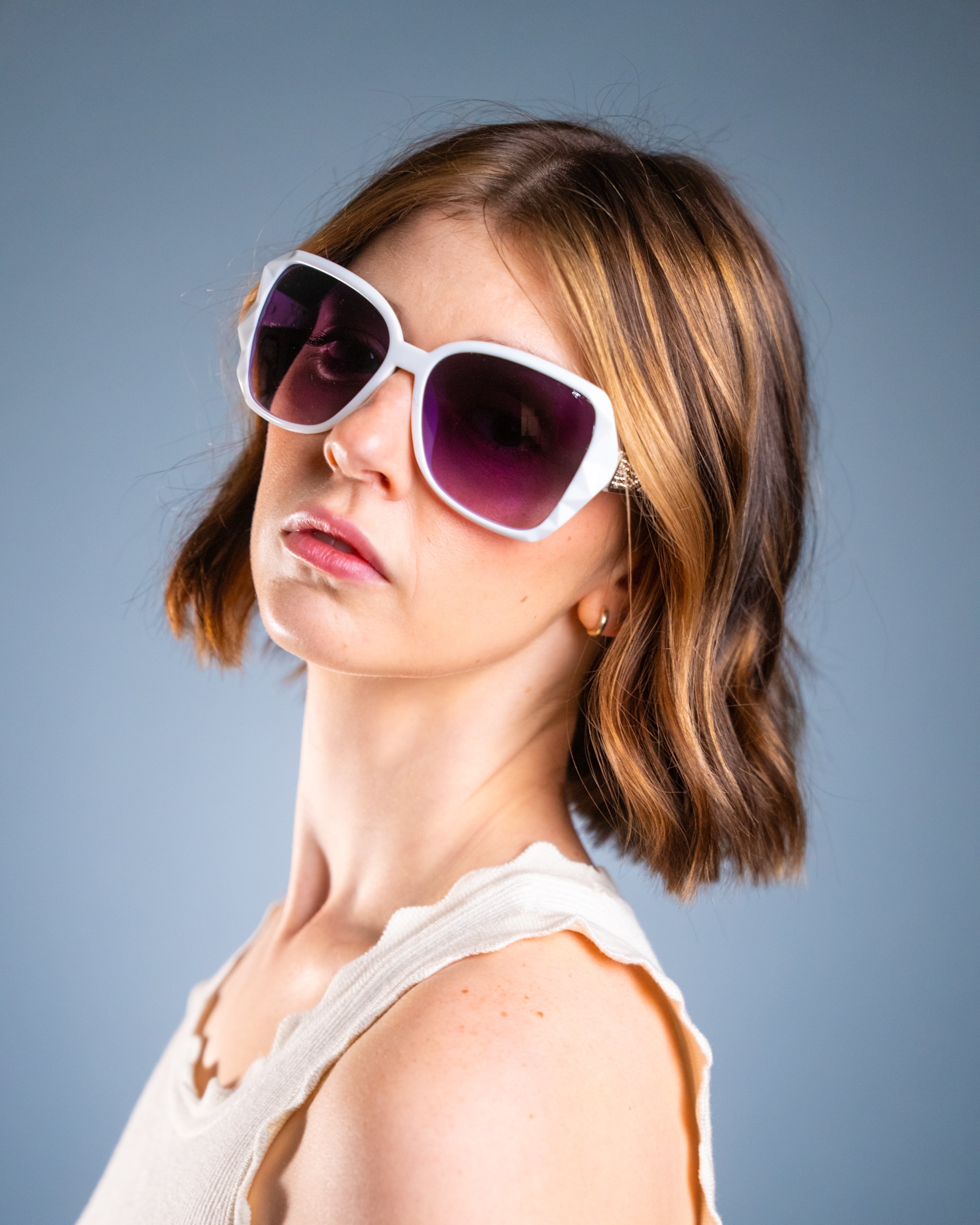 Model wearing LadyBoss Mavens sunglasses in White #frame color_white