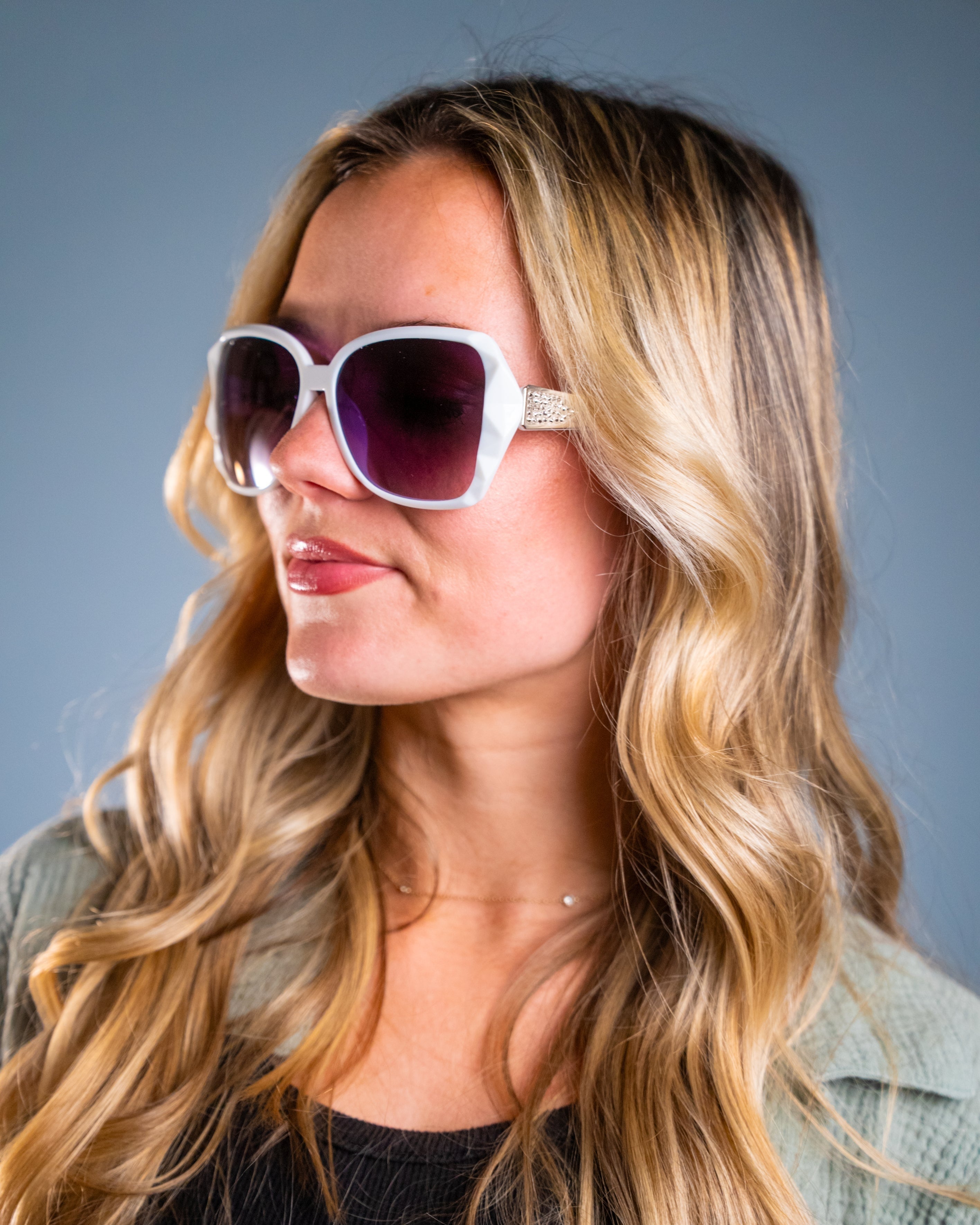 Model wearing LadyBoss Mavens sunglasses in White #frame color_white