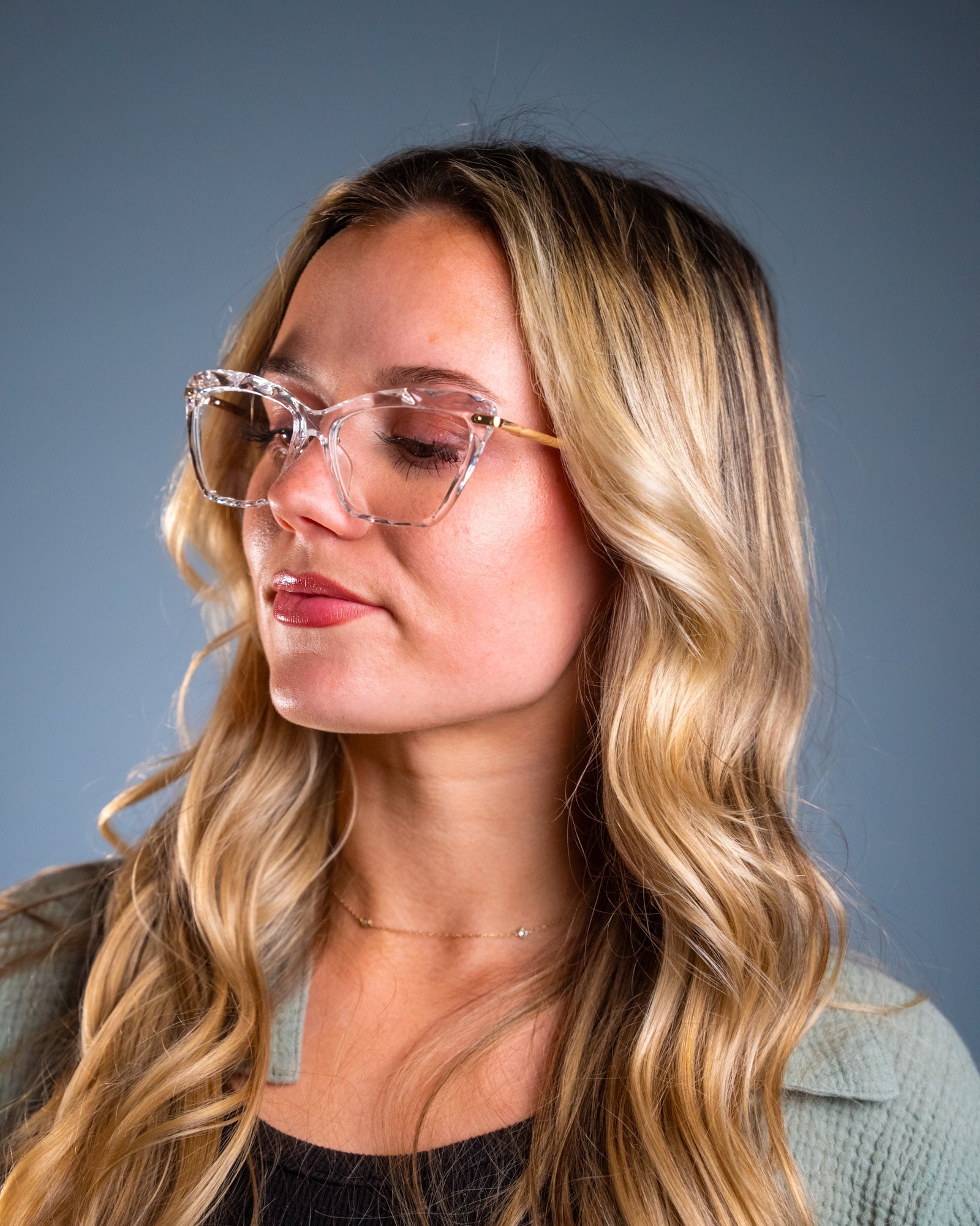 Model wearing LadyBoss Savants eyeglasses in Crystal Clear