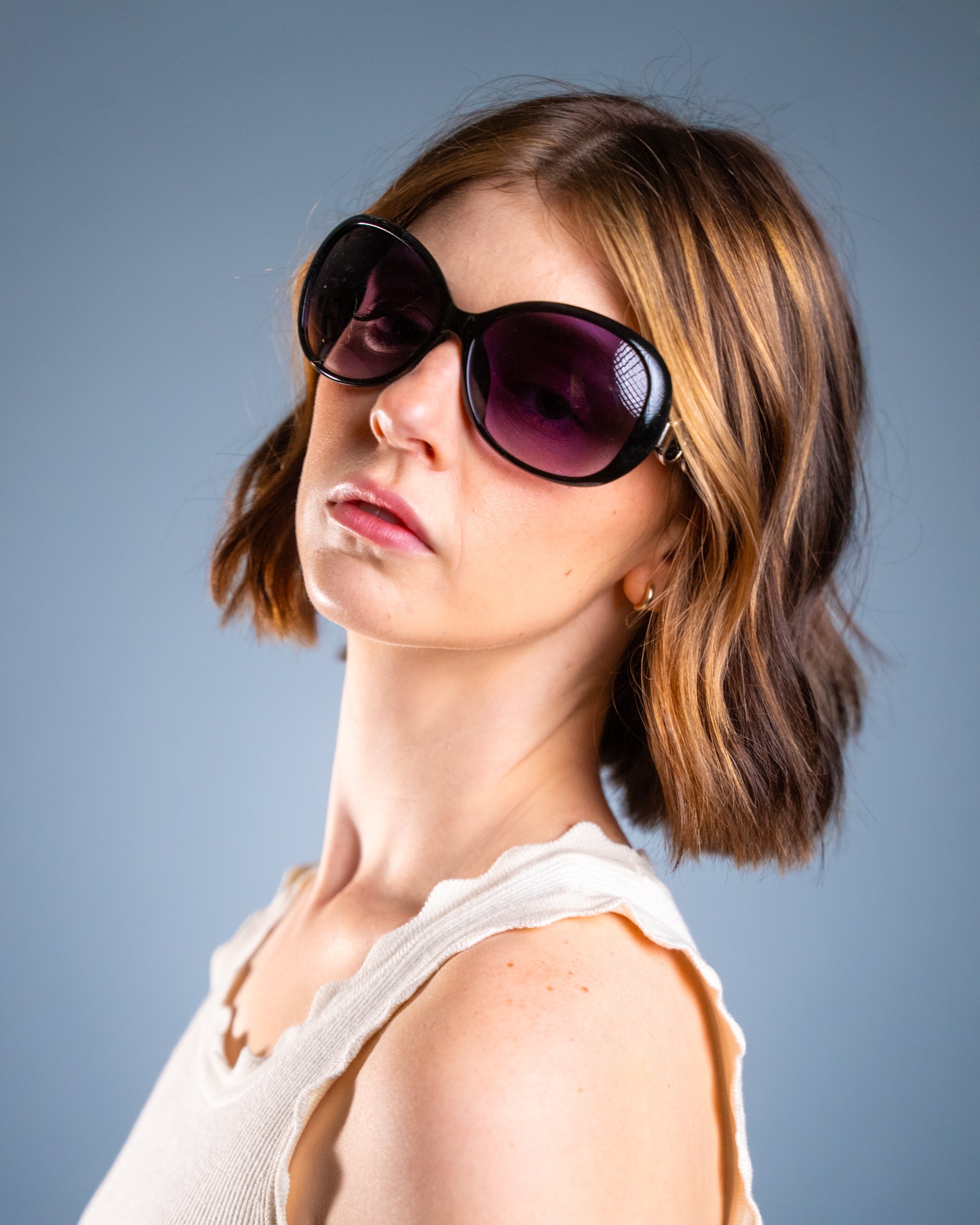 Model wearing LadyBoss Spectacles sunglasses in Black #frame color_black