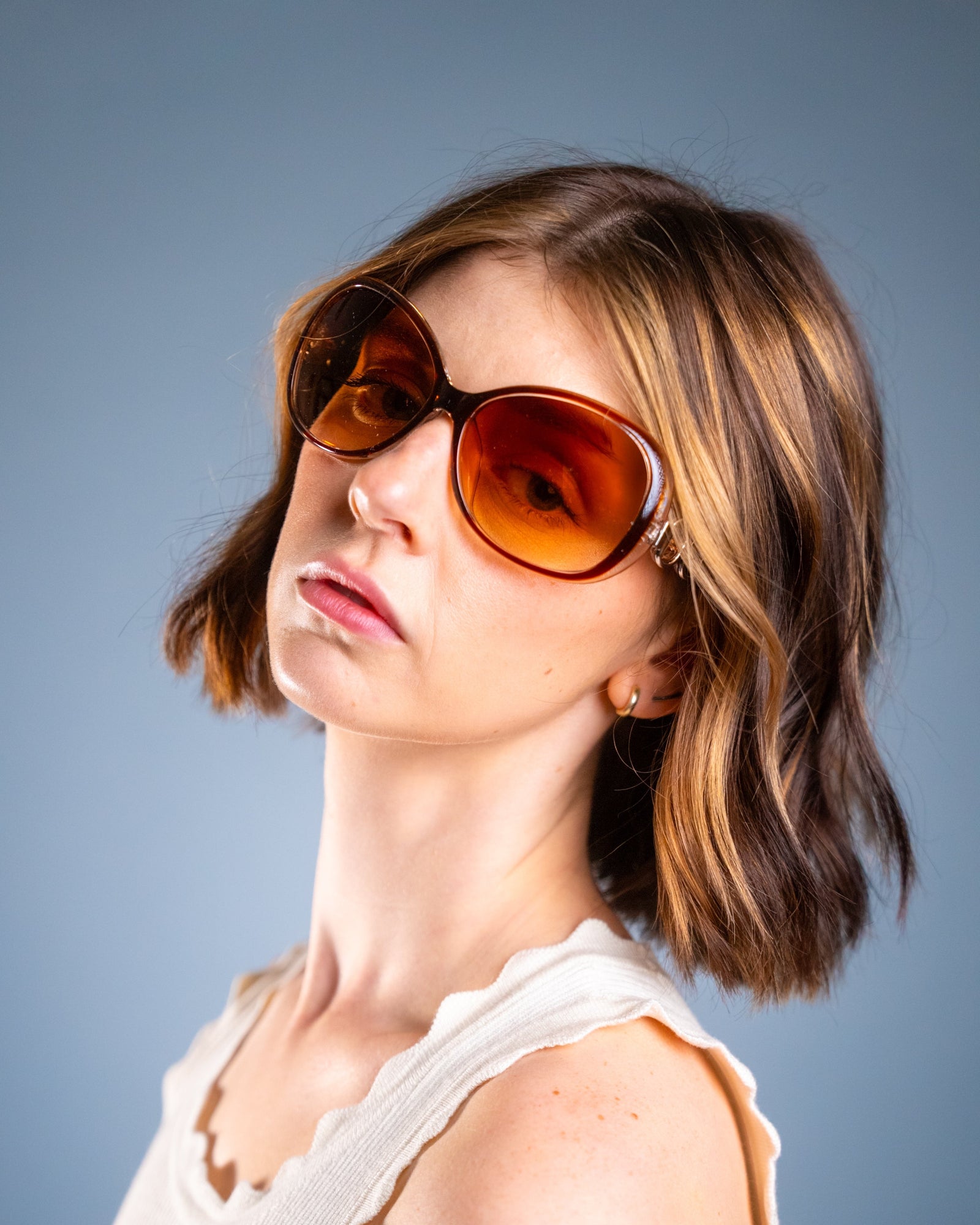 Model wearing LadyBoss Spectacles sunglasses in Amber