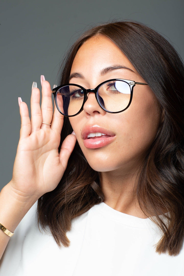 Woman wearing black Icons blue light glasses